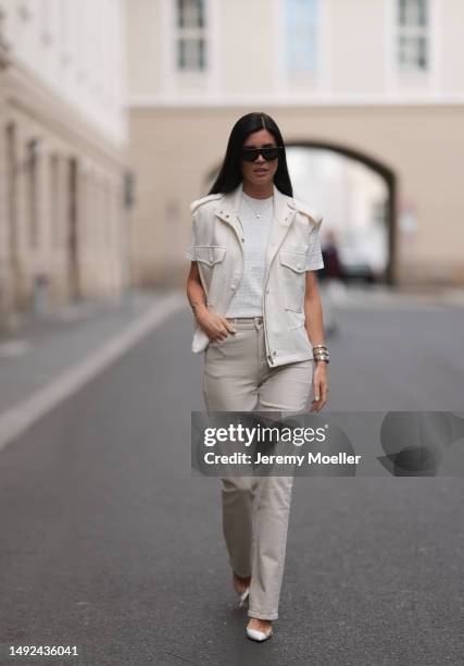 Leo Eberlin seen wearing Fendi logo beige and white shirt, Gianvito Rossi white transparent heels, Zara linen beige skinny jeans, The Frankie Shop...