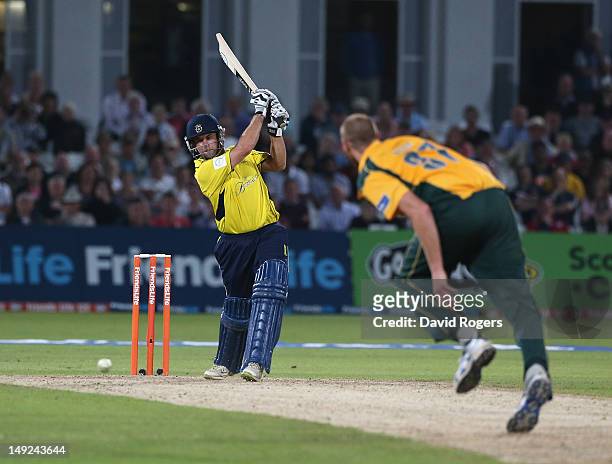 Neil McKenzie of Hampshire drives the ball for four runs during the Friends Life T20 match between Nottinghamshire and Hampshire at Trent Bridge on...