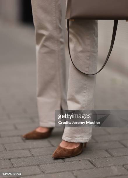 Leo Eberlin seen wearing Zara linen wide leg beige pants, Hermes Kelly 25 leather bag, Gianvito Rossi velvet beige brown leather heels on May 19,...