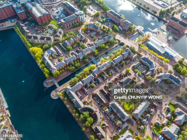 drone view of media city salford quays, manchester - manchester high street stock pictures, royalty-free photos & images