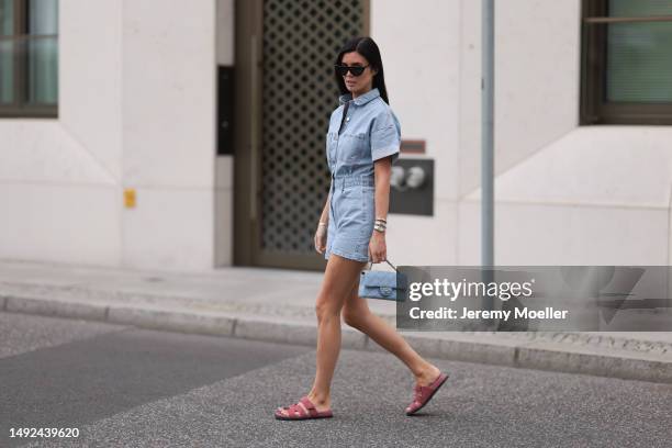 Leo Eberlin seen wearing Zara short denim blue jumpsuits, Hermes velvet rose Chypre sandals, Chanel denim blue flapbag and Celine brown shades on May...