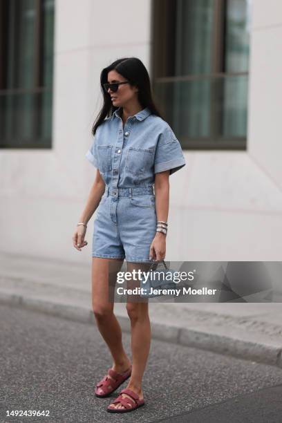 Leo Eberlin seen wearing Zara short denim blue jumpsuits, Hermes velvet rose Chypre sandals, Chanel denim blue flapbag and Celine brown shades on May...