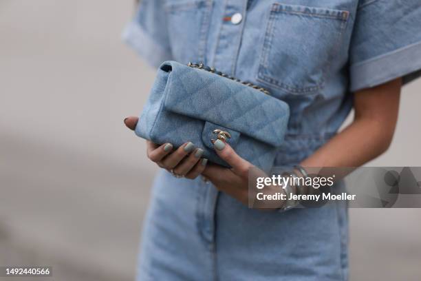 Leo Eberlin seen wearing Zara short denim blue jumpsuits, Hermes velvet rose Chypre sandals, Chanel denim blue flapbag and Celine brown shades on May...