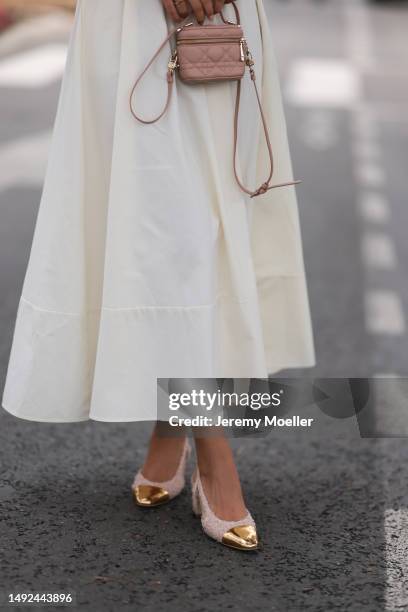 Jessica de Oliviera seen wearing Dior bag, Chanel heels and a flowy long dress with cutouts during the 76th Cannes film festival on May 21, 2023 in...