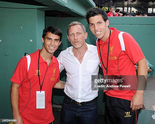 Actor Daniel Craig and supporter of Liverpool meets with Daniel Pacheco and Suso of Liverpool is seen during the Pre Season tour friendly between...