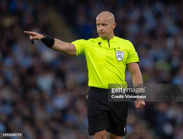 Referee Szymon Marciniak during the UEFA Champions League semi-final second leg match between Manchester City FC and Real Madrid at Etihad Stadium on...