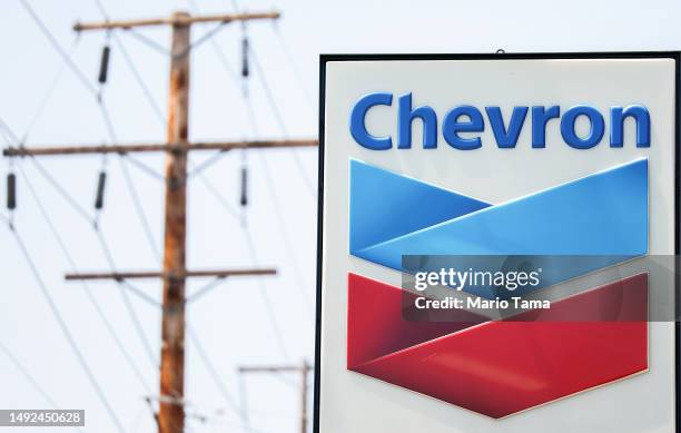 The Chevron logo is displayed at a Chevron gas station on May 22, 2023 in Burbank, California. Chevron is doubling down in the shale sector with an...