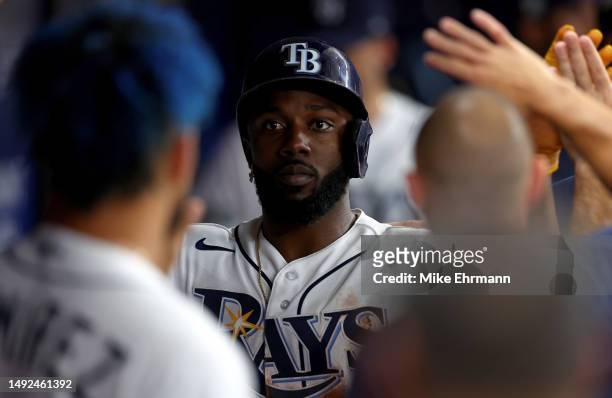 Randy Arozarena of the Tampa Bay Rays is congratulated after scoring a run in the second inning during a game against the Toronto Blue Jays at...