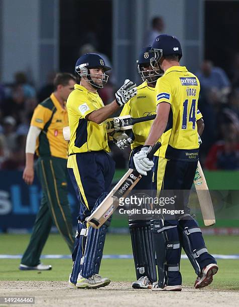 Neil McKenzie of Hampshire celebrates with team mates after scoring the match winning run off the final over during the Friends Life T20 match...