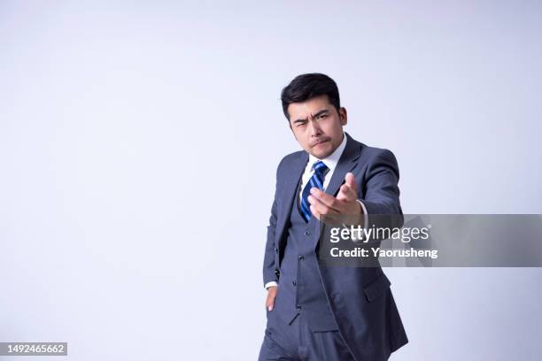 portrait of a confident  asian successful businessman against white background - pudong stock pictures, royalty-free photos & images