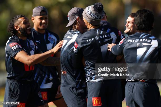 The Blues backs share a laugh during a New South Wales Blues State of Origin training session at Coogee Oval on May 23, 2023 in Sydney, Australia.