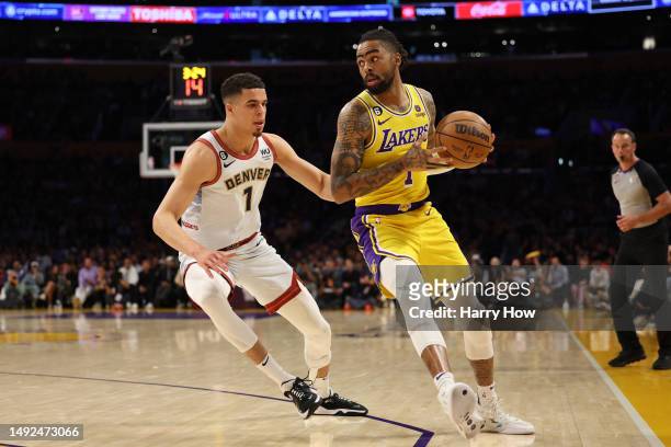 Angelo Russell of the Los Angeles Lakers looks to pass the ball in front of Michael Porter Jr. #1 of the Denver Nuggets during the first quarter in...