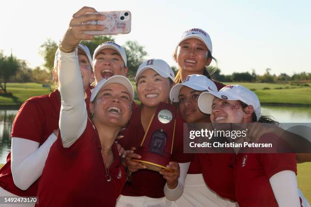 Rose Zhang of the Stanford Cardinal poses with the trophy and teammates after winning the NCAA women’s Golf Championships at Grayhawk Golf Club on...