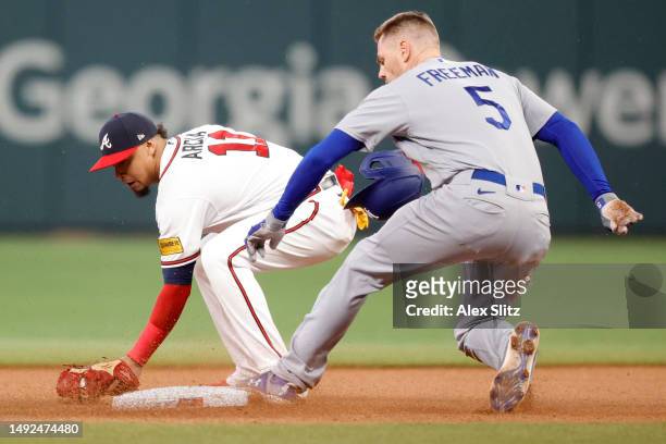 Freddie Freeman of the Los Angeles Dodgers arrives at second base ahead of the tag from Orlando Arcia of the Atlanta Braves in the fourth inning at...