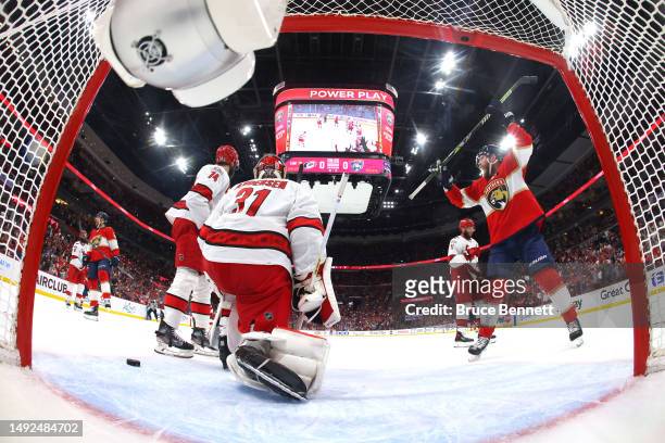 Sam Bennett of the Florida Panthers celebrates teammate Sam Reinhart who scored a goal on Frederik Andersen of the Carolina Hurricanes during the...