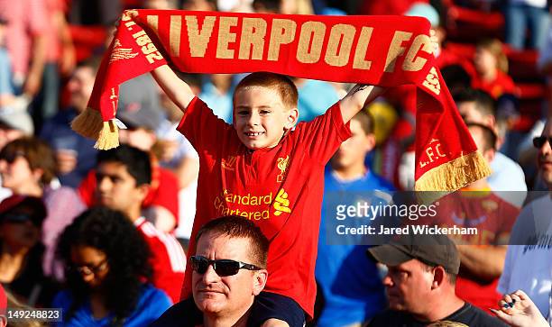 Young Liverpool fan cheers prior to the pre-season tour friendly match against AS Roma on July 25, 2012 at Fenway Park in Boston, Massachusetts.