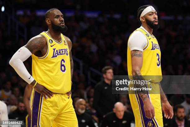 LeBron James and Anthony Davis of the Los Angeles Lakers react to a Laker foul during the third quarter against the Denver Nuggets in game four of...