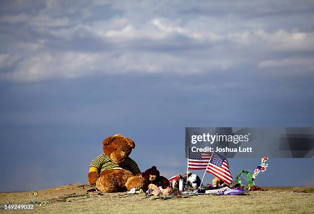 Teddy bears are seen as part of a memorial across the street from the Century 16 movie theatre July 25, 2012 in Aurora, Colorado....