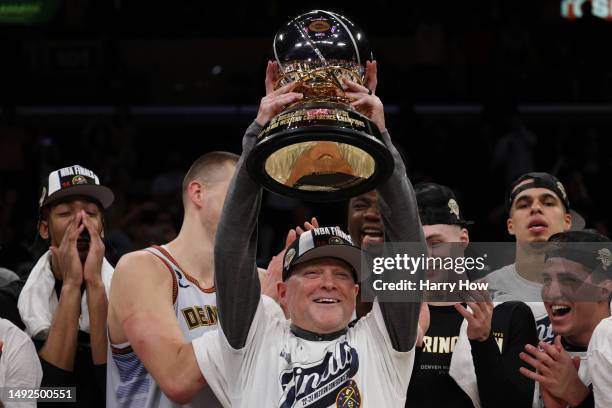 Head coach Michael Malone of the Denver Nuggets celebrates with the Western Conference Championship Trophy after defeating the Los Angeles Lakers in...