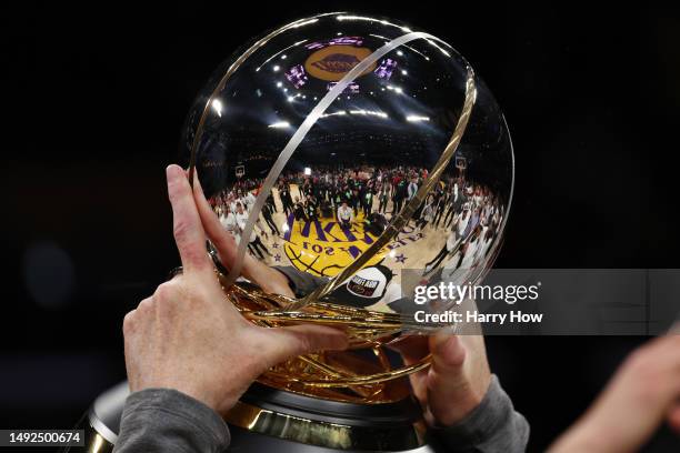 The court is seen reflected in the Western Conference Championship Trophy after the game between the Los Angeles Lakers and the Denver Nuggets in...