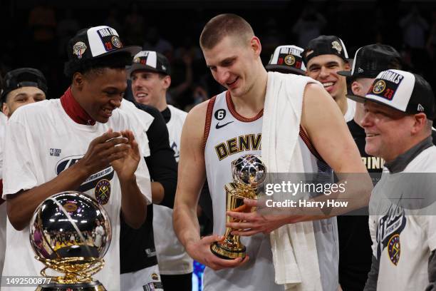 Nikola Jokic of the Denver Nuggets celebrates with teammates after receiving the Most Valuable Player Trophy following game four of the Western...