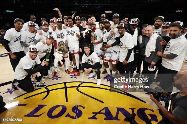 Members of the Denver Nuggets pose with the Western Conference Championship Trophy following their victory against the Los Angeles Lakers in game...