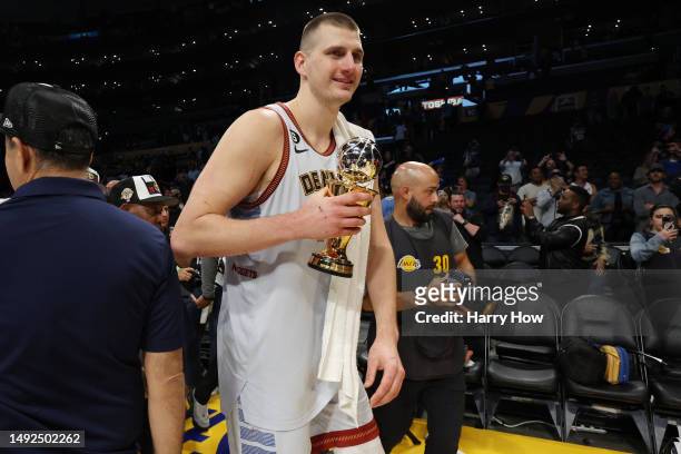 Nikola Jokic of the Denver Nuggets celebrates with the Most Valuable Player trophy following the game four and series victory against the Los Angeles...