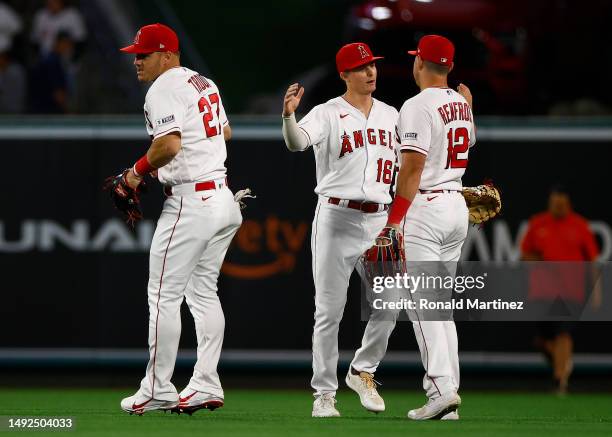 Mickey Moniak, Mike Trout and Hunter Renfroe of the Los Angeles Angels celebrate a win against the Boston Red Sox at Angel Stadium of Anaheim on May...