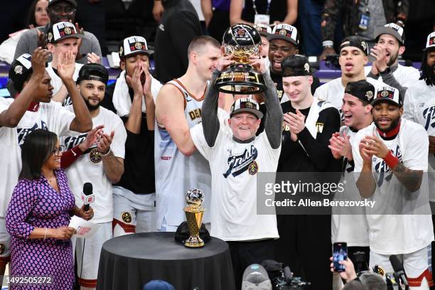 Head coach Michael Malone of the Denver Nuggets celebrates with the Western Conference Championship Trophy after defeating the Los Angeles Lakers in...
