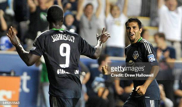 Eddie Johnson of MLS All-Stars celebrates with Steven Beitashour after Johnson scores a go-ahead goal late in the second half during the 2012 AT&T...