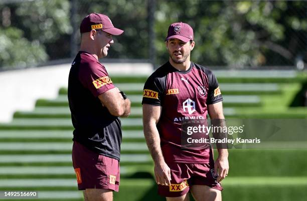 Ben Hunt chats with former Queensland player Cameron Smith during the QLD Maroons State of Origin team training session at the Clive Berghofer Centre...