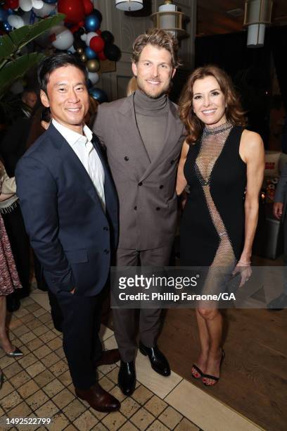 Eugene Kim, Travis Van Winkle, and Fabiana Udenio attend the after party for the Los Angeles premiere of Netflix's "FUBAR" at Alma Restaurant on May...