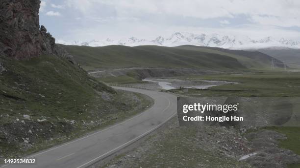 snowy mountains and roads - 美國 stock pictures, royalty-free photos & images