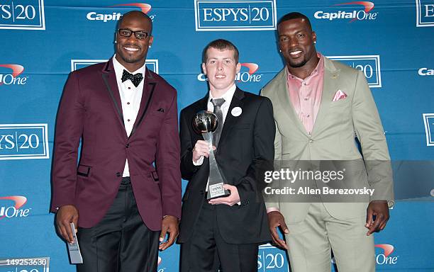 Players Vernon Davis and Patrick Willis of the San Francisco 49ers and Jimmy Murphy pose in the press room during the 2012 ESPY Awards at Nokia...