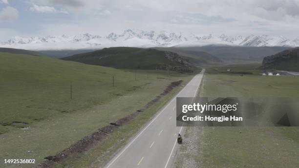 snowy mountains and roads - 美國 stock pictures, royalty-free photos & images