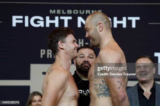 Cam Mooney and Tom Bellchambers face off at the weigh in ahead of their bout at Margaret Court Arena on May 23, 2023 in Melbourne, Australia.