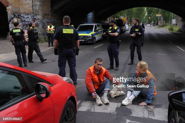 Police prepare to remove activists of the Last Generation climate action group who had blocked Puschkinallee avenue by gluing themselves to the...