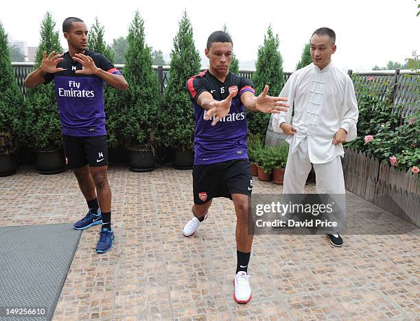 Alex Oxlade-Chamberlain and Theo Walcott of Arsenal FC are given a lesson in Kung Fu by Zhang Yuxan a Traditional Kung Fu Master in the St. Regis...