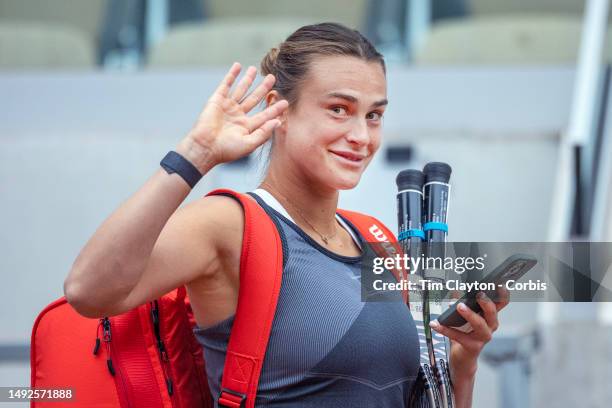 Aryna Sabalenka of Belarus waves to photographers as she arrives for practice on Court Suzanne Lenglen in preparation for the 2023 French Open Tennis...