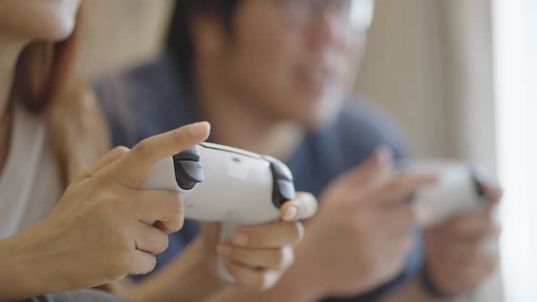 https://media.gettyimages.com/id/1492597779/video/close-up-shot-of-asian-couple-enjoy-playing-game-with-controller.jpg?b=1&s=640x640&k=20&c=KOy-R9whw4kgmLgDWp_V_xbd25YjW8LMDzOdXh0CBJ4=