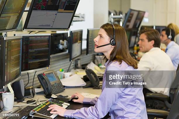 usa, new york, new york city, traders at trading desk - trading floor stock pictures, royalty-free photos & images