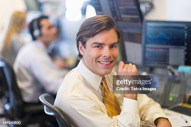 usa, new york, new york city, portrait of male trader at trading desk - us stock exchange trading floor stock pictures, royalty-free photos & images