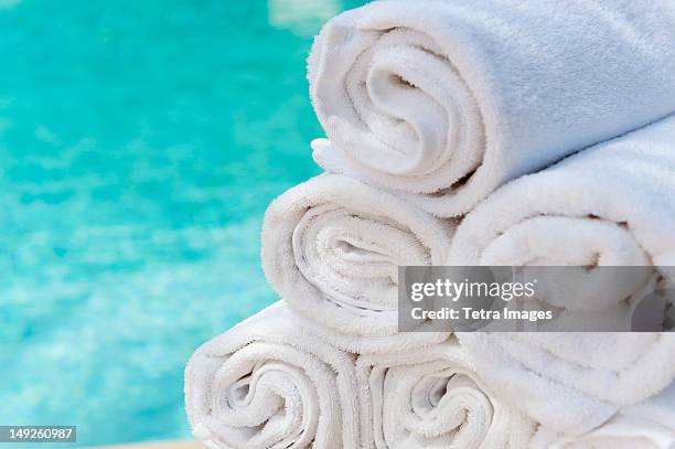 mexico, yucatan, rolled up towels in front of water - public pool stock pictures, royalty-free photos & images