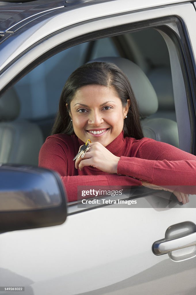 USA, New Jersey, Jersey City, Woman sitting in her new car