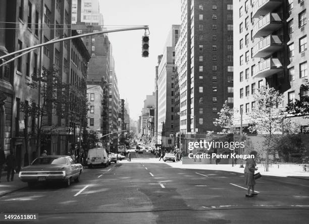 Traffic and pedestrians on Park Avenue, in a view looking south from 35th Street, in the borough of Manhattan, New York City, New York, October 1975.
