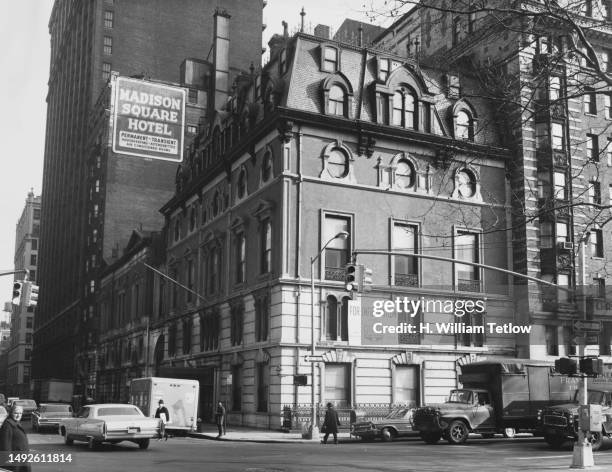 Herbert Charles' real estate board adorns the facade of the Jerome Mansion on the corner of East 26th Street and Madison Avenue, a sign for the...