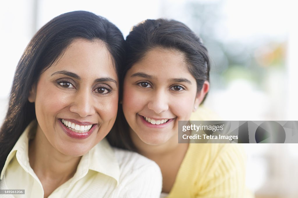 USA, New Jersey, Jersey City, Portrait of mother and daughter (12-13) at home