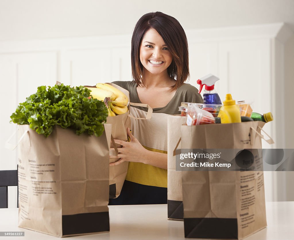 Young woman with paper bags after shopping