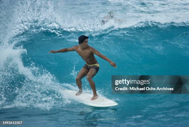 Surfer on the set of 'Big Wednesday' on the waters off Sunset Beach, on the north shore of Oahu , Hawaii, September 1977. The American coming-of-age...