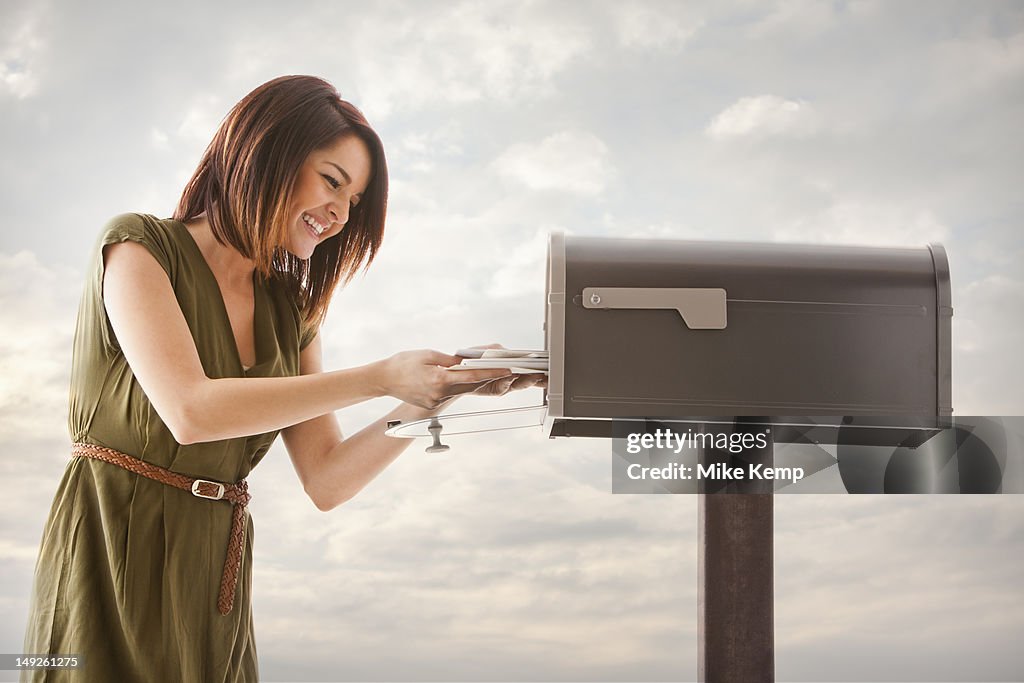 Young woman at mailbox